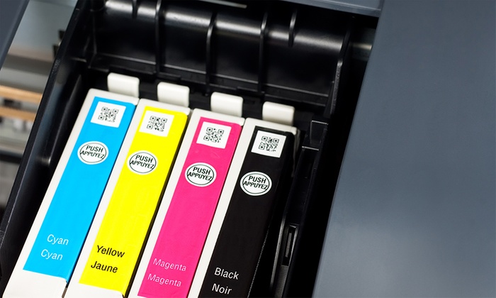 Four coloured ink cartridges in a printer